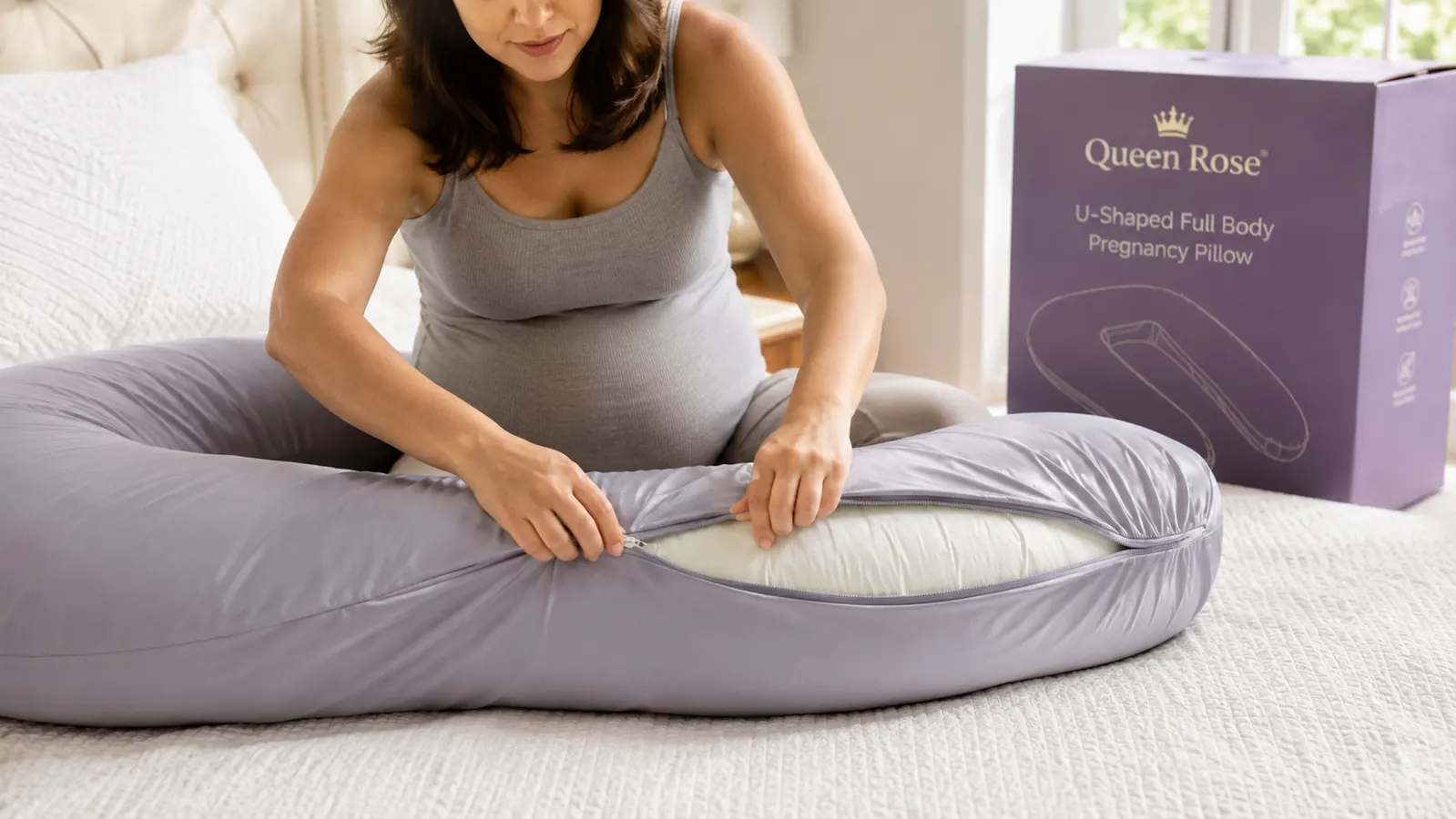 Close-up of a hand pulling back the cooling silky cover on the Queen Rose body pillow to show the removable zipper cover